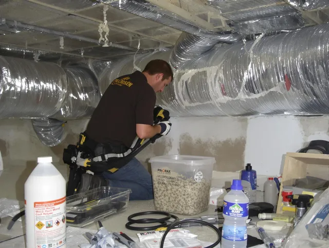 Portsmouth Air Duct Cleaning specialist performing professional mold removal from air ducts in Portsmouth
