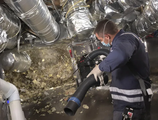 Portsmouth Air Duct Cleaning specialist operating negative pressure cleaning equipment for thorough duct maintenance in Portsmouth