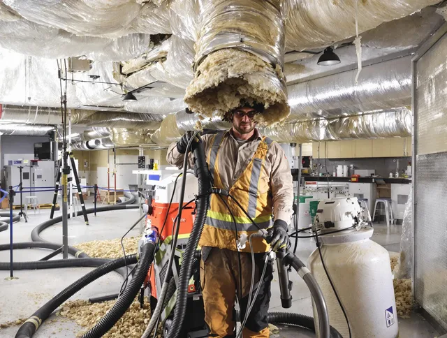 Professional vacuum insulation removal by Portsmouth Air Duct Cleaning expert in Portsmouth